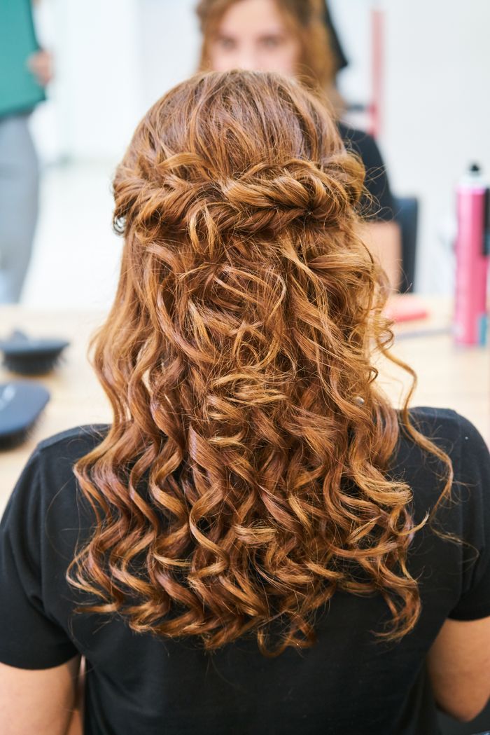 services-01 Rear view of elegant curly hairstyle in a hair salon setting.